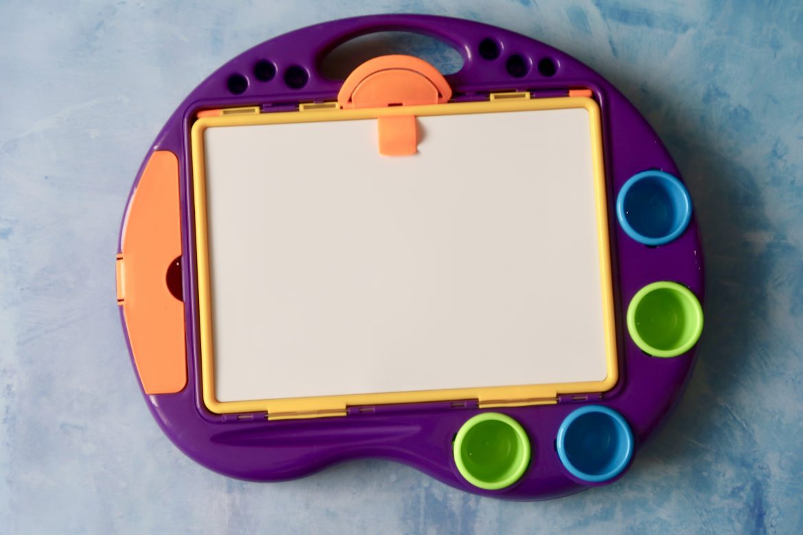 A brightly coloured art station on a blue background