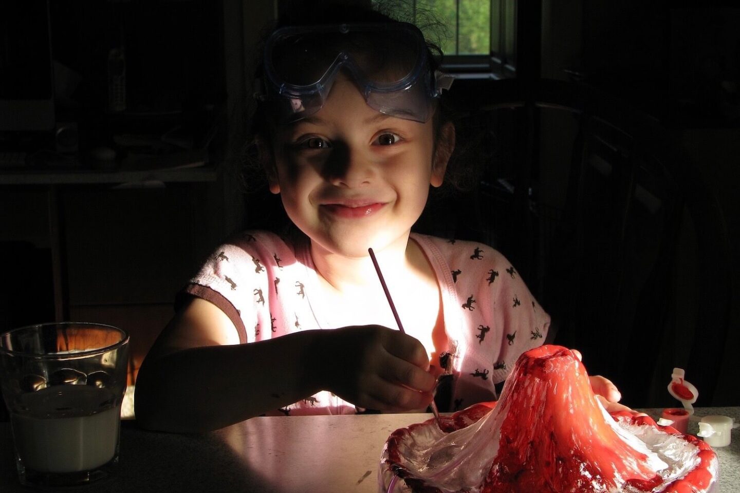 A child painting a model volcano