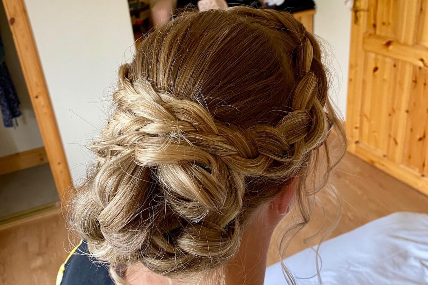 A braided up-do for a wedding guest