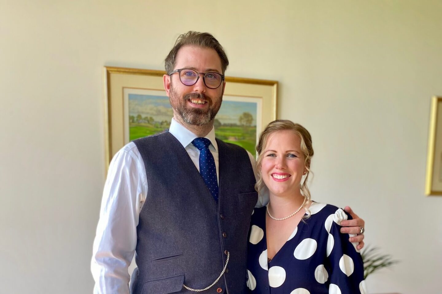 A man and a woman dressed up for a wedding