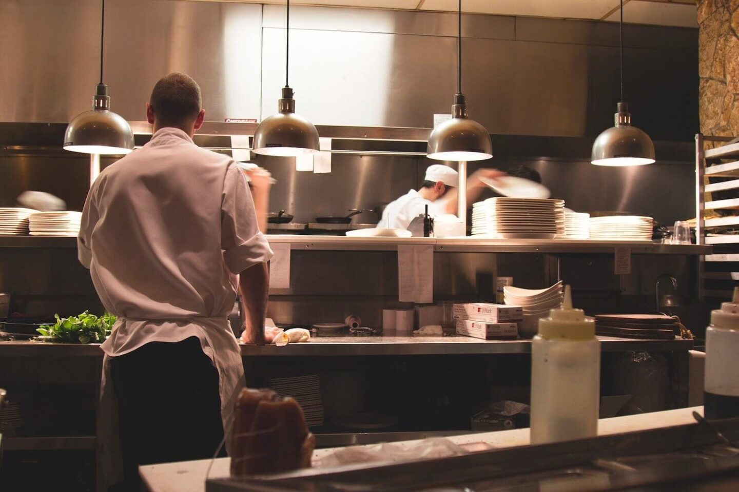 2 chefs in a restaurant kitchen