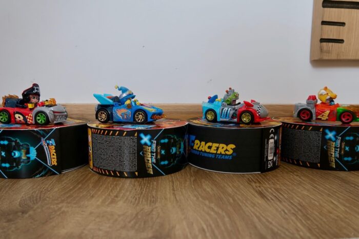 4 t-racer cars sitting on top of turbo wheel boxes