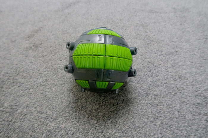 A green and grey Gigabot Energy Core ball
