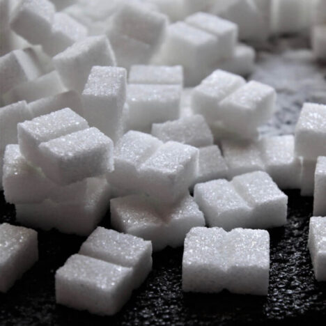 Sugar cubes on a black surface