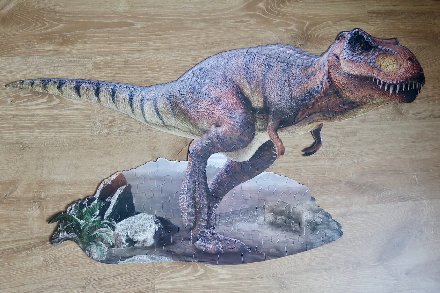 A jigsaw in the shape of a T-rex