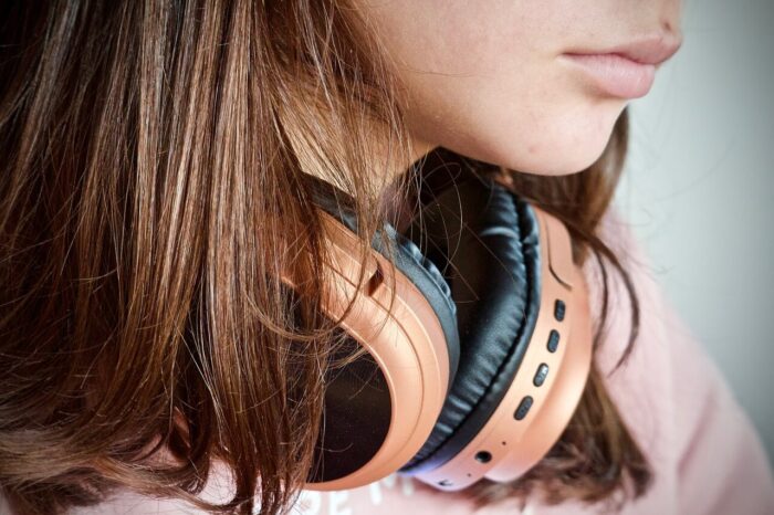 Headphones round a girls neck