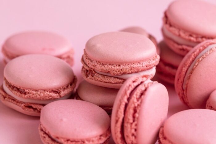 Pink macarons on a pink background