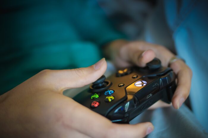Hands holding an X-Box controller
