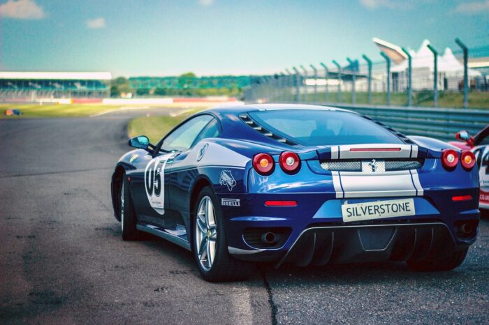A blue Ferrari on a race track