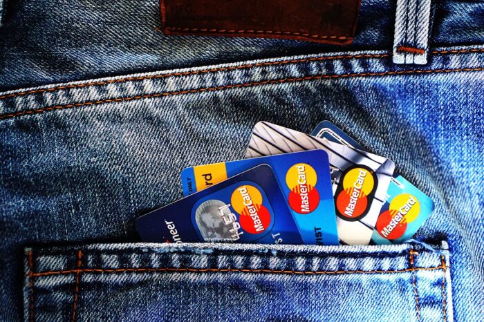 A jeans pocket with credit cards sticking out