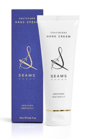A white tube of hand cream with a blue storage box