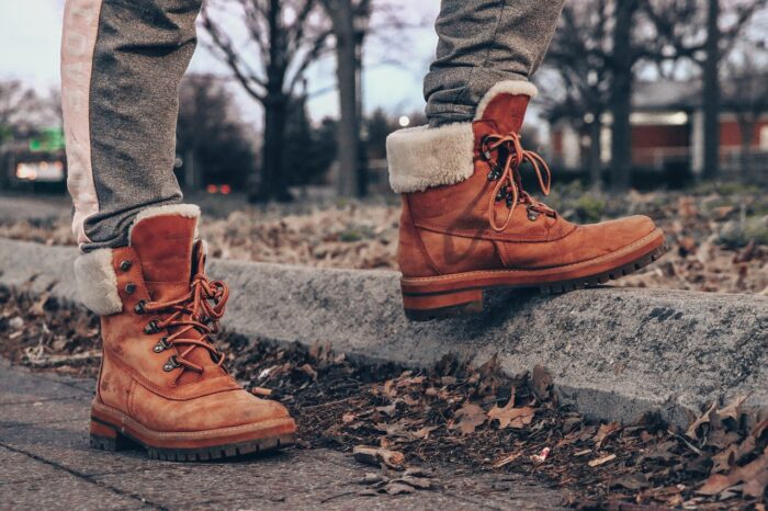 brown masculine boots with a white sheepskin trim